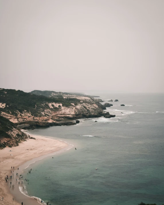 there are many surfers at the ocean