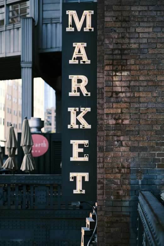 a large market sign mounted on the side of a building