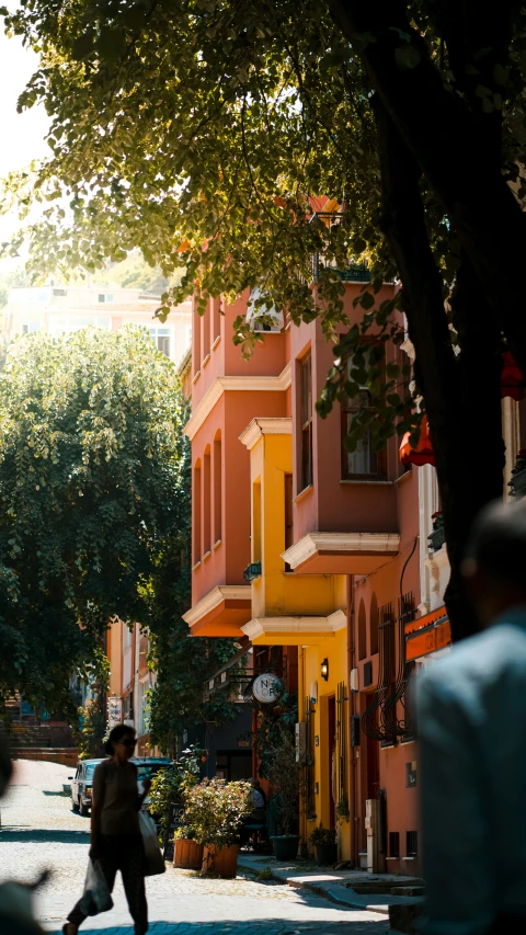 an older lady walking through the street of an old town