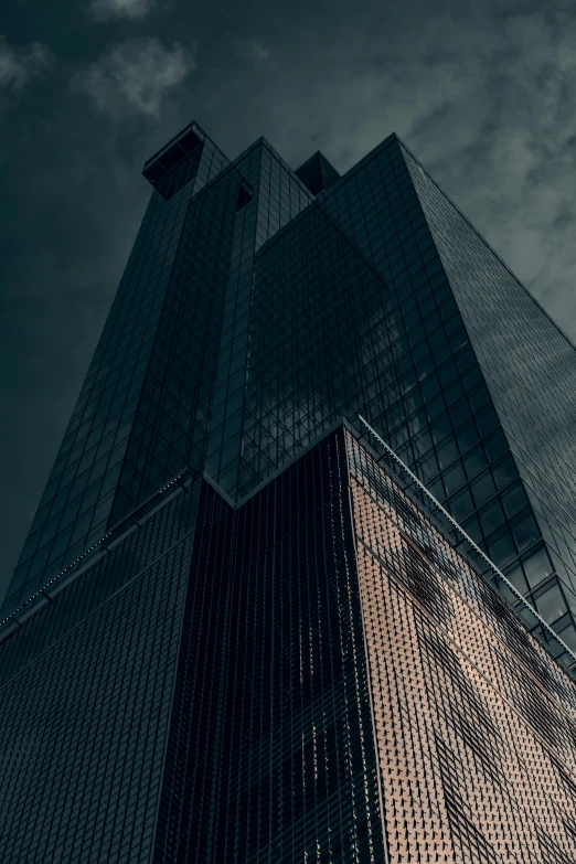 tall buildings are seen against a dark sky