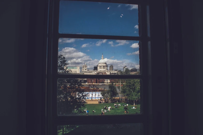 a view from an open window onto a city skyline