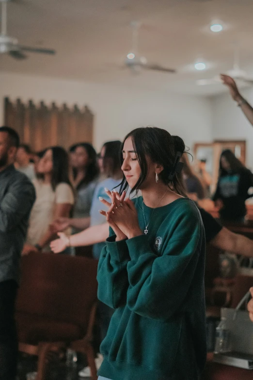 people in an audience are clapping and standing