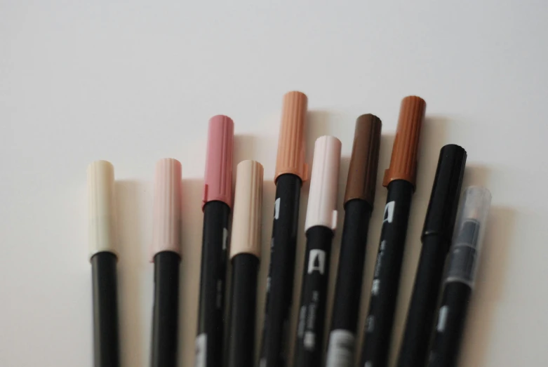 a collection of pencils and markers with different types of colors