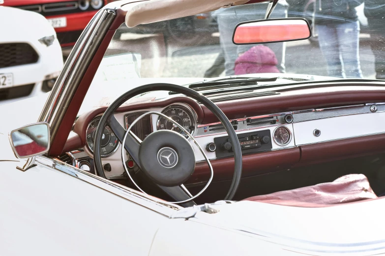 interior of a car with white walls and leather seats