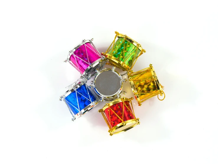 four different colored diamond rings sitting on top of each other