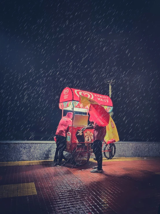 people with red umbrellas are standing in the rain