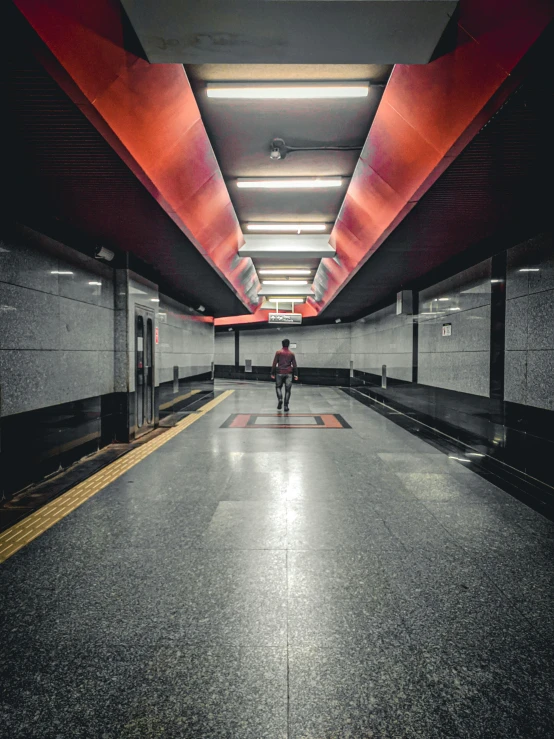 an empty parking garage with two people in it