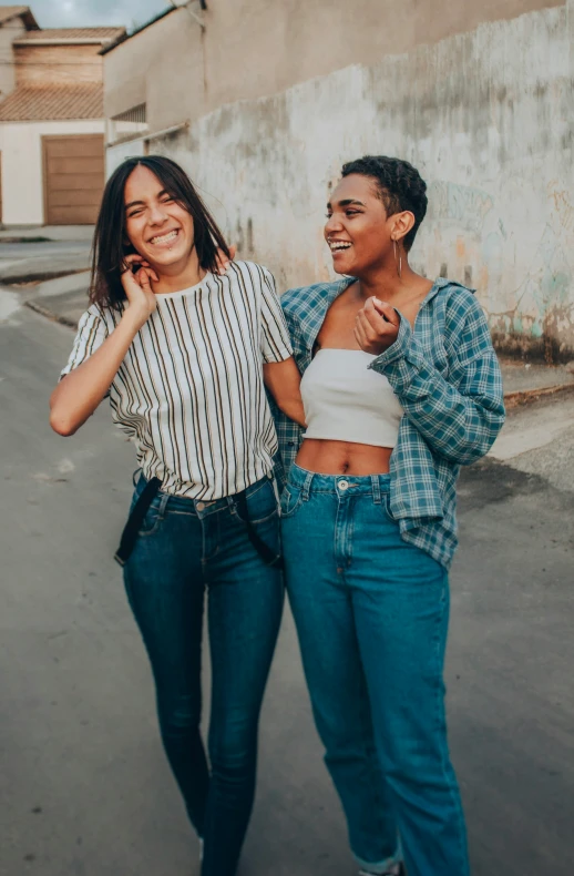 two young women who are standing by each other