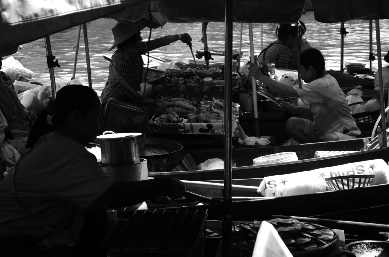 a group of people riding on the back of a boat