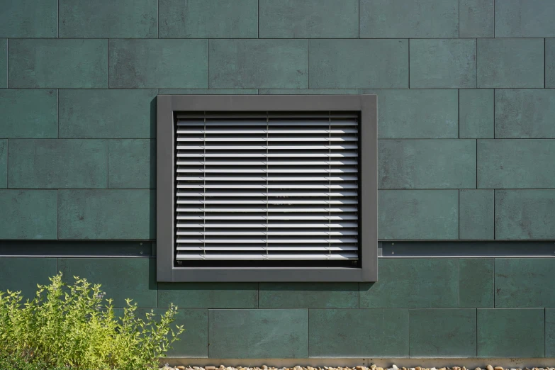 an exterior po of an office building with shutters in the window