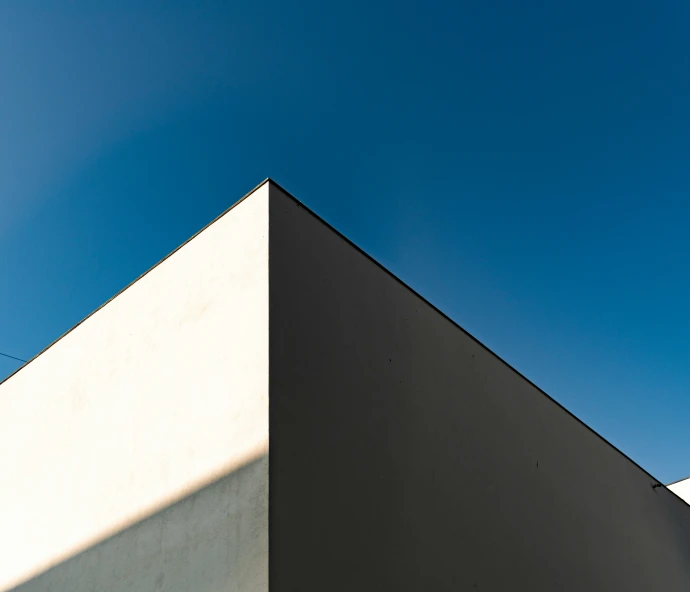 a black and white building on a clear day