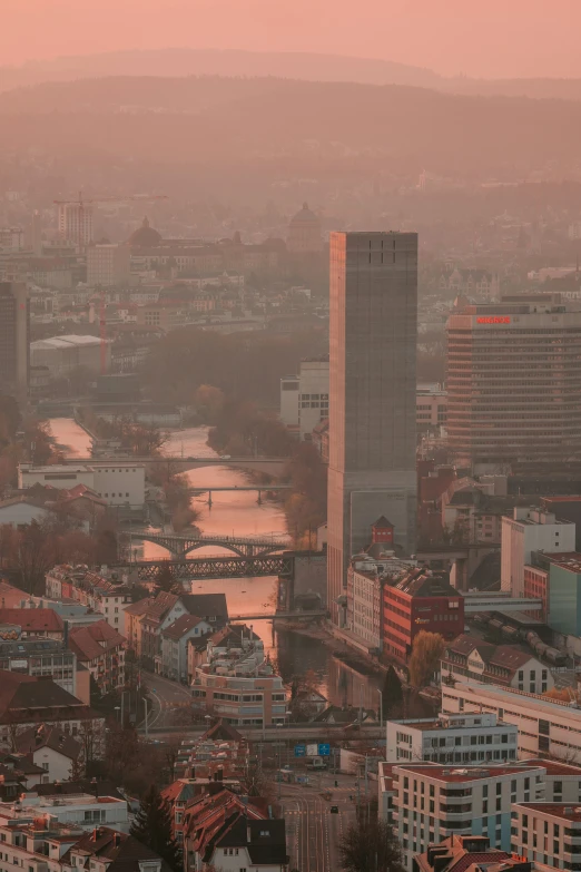 a city has tall buildings and a river