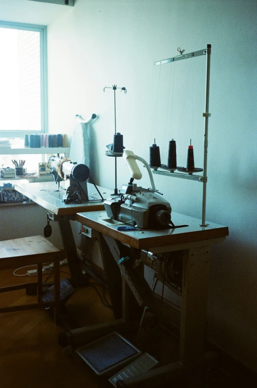 an industrial sewing machine is sitting in a studio