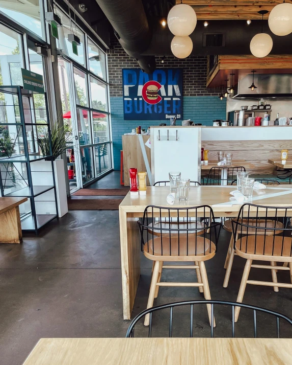 some chairs are set up around a wooden table