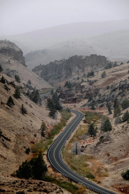 a view of a freeway, mountain and road from the air