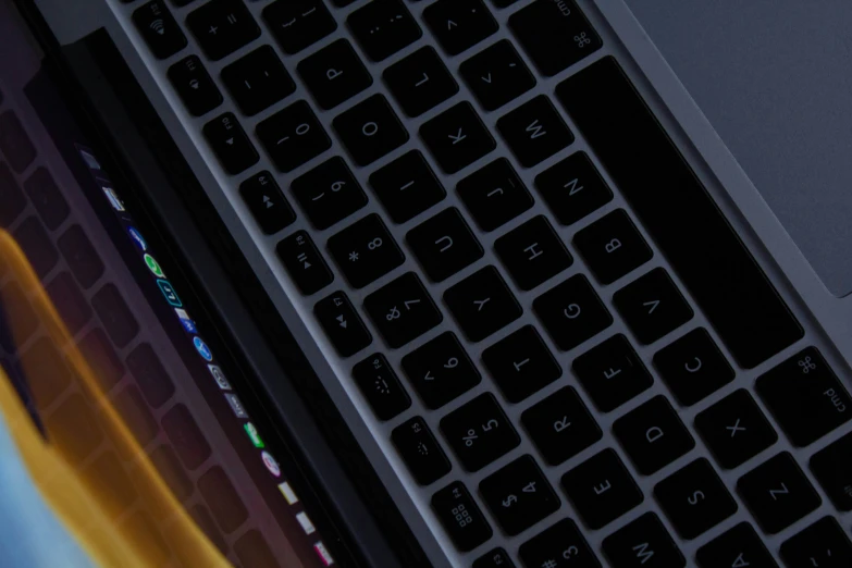 a view of a mac laptop from the bottom, with its key pad partially visible