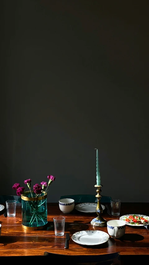 a table topped with lots of plates and bowls