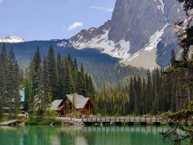 a large mountain in the distance with a lake near by