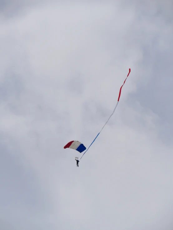 a colorful kite flying high in the air