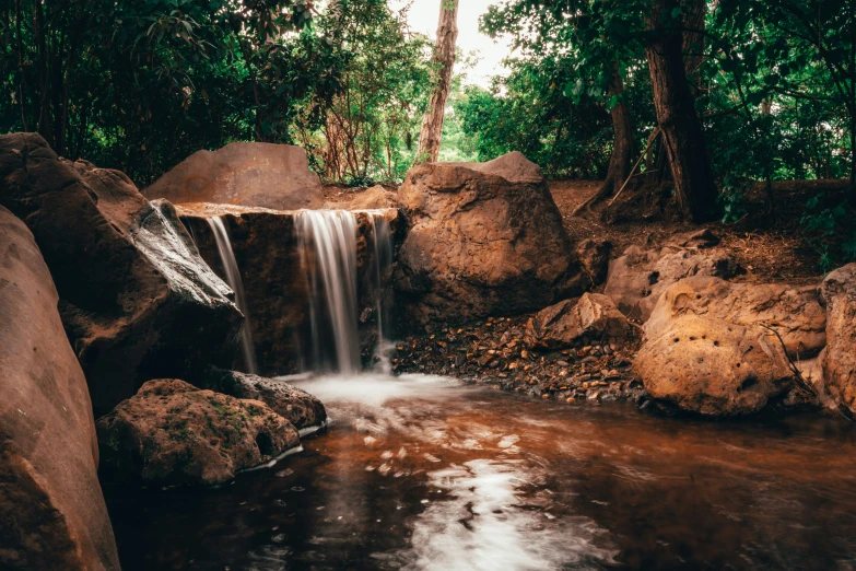 waterfall, rocks and water in tropical forest