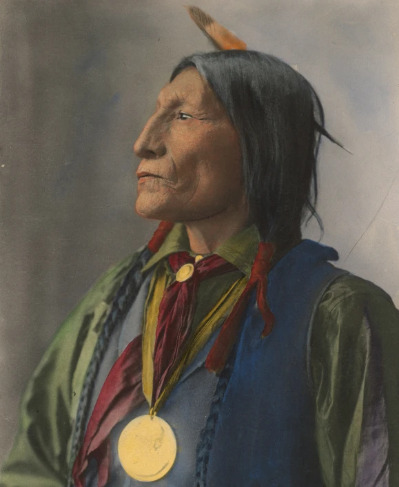 an indian warrior posing with his medal