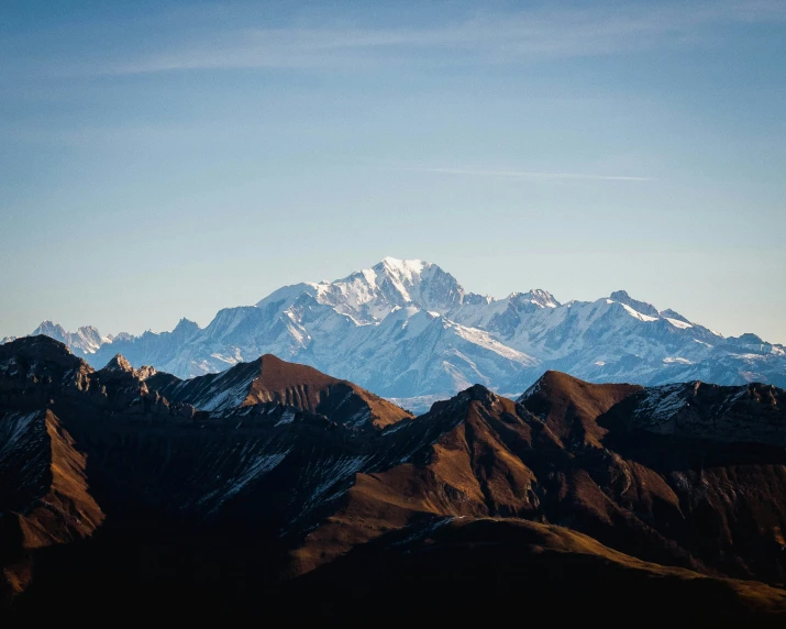 a mountain top against a blue sky