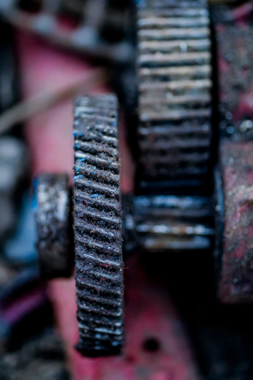 a close - up of an assortment of gears, that are different colors