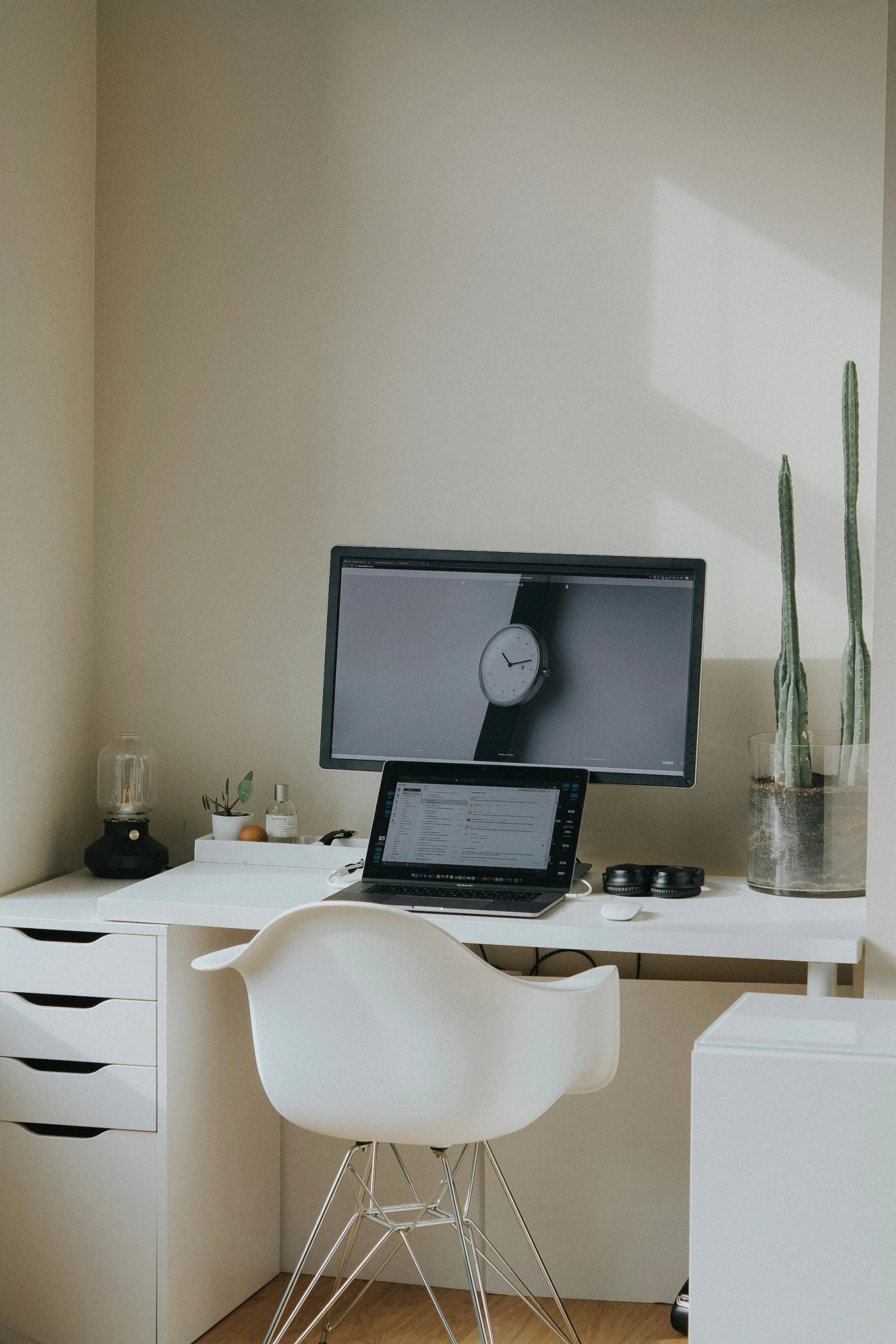 a desk that has some computers on it