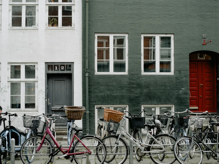 there are many bikes parked in front of this house