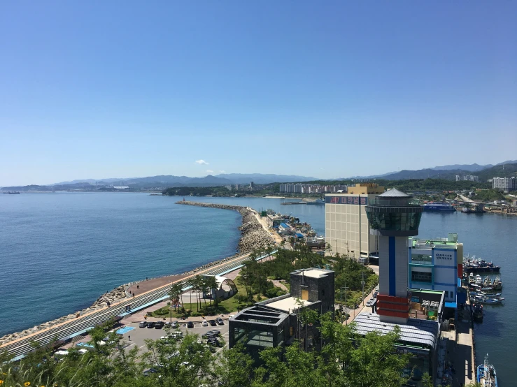 an ocean front with a harbor and a bunch of buildings