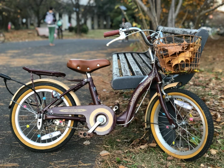 a small bicycle with a basket sitting on top of it