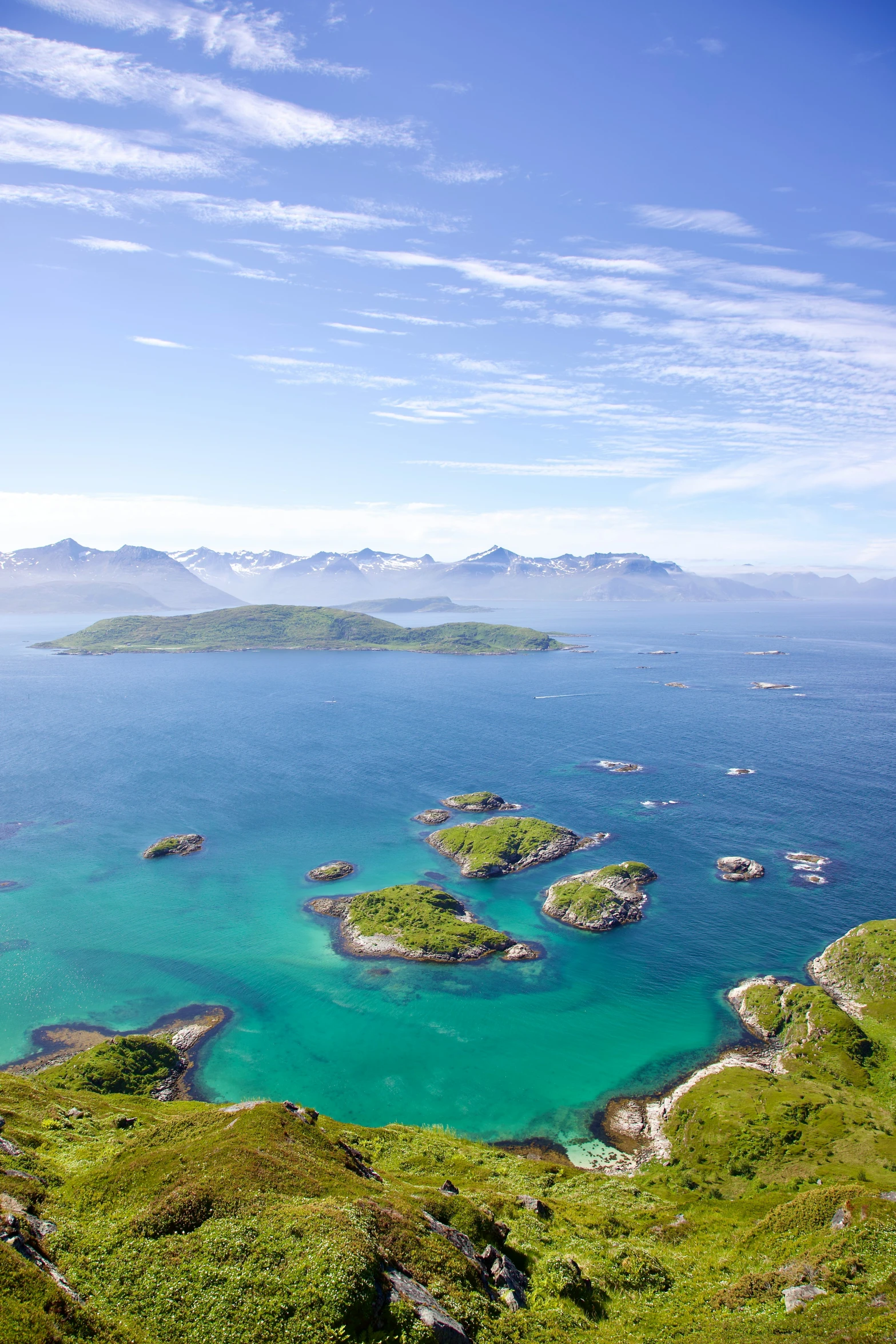 an island is shown with small green islands in the water