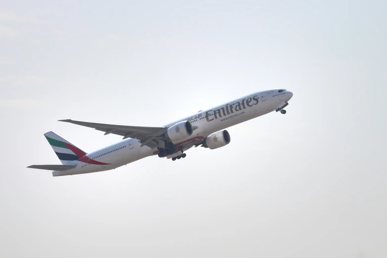 a airplane flies overhead on a clear day