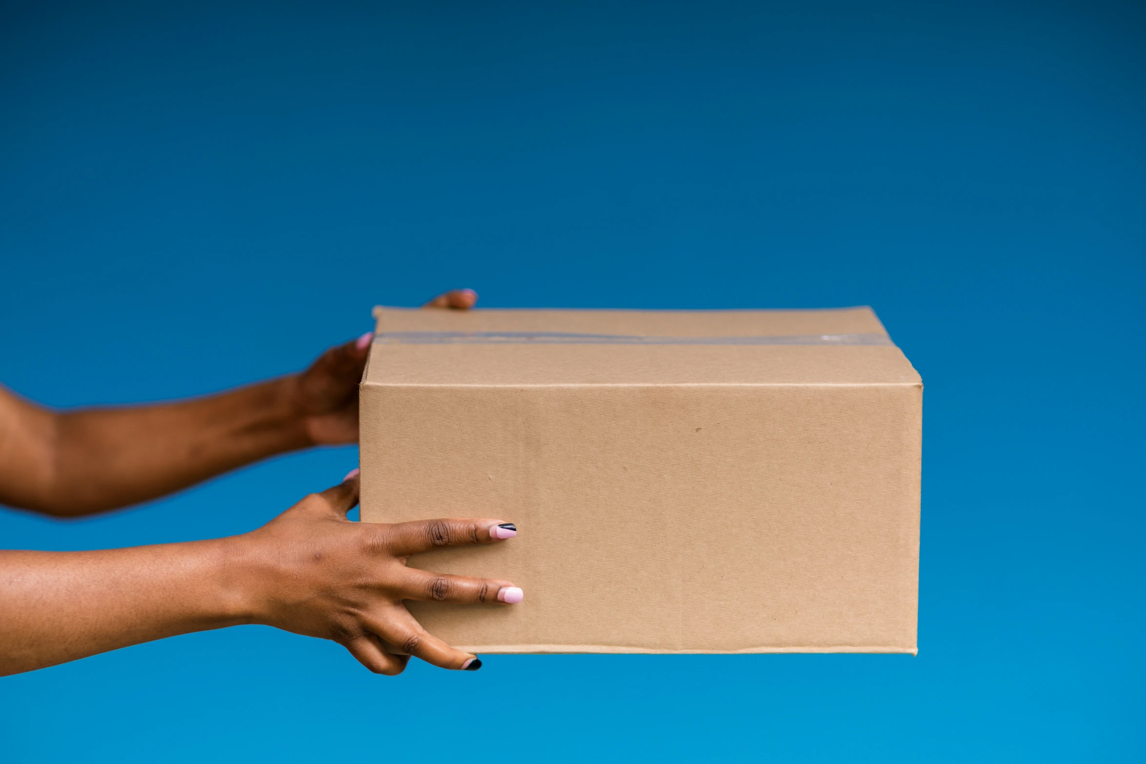 someone holding up a box with both hands