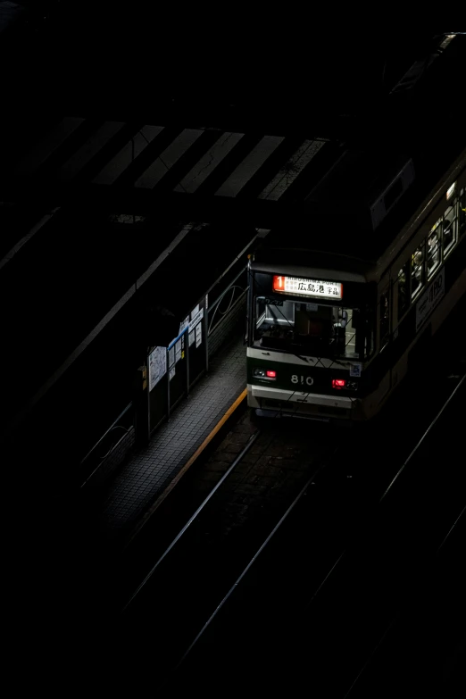 a train on the tracks in the dark