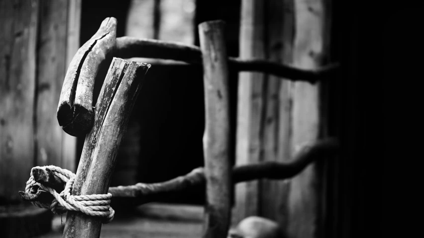 a rustic door that has rope wrapped around it