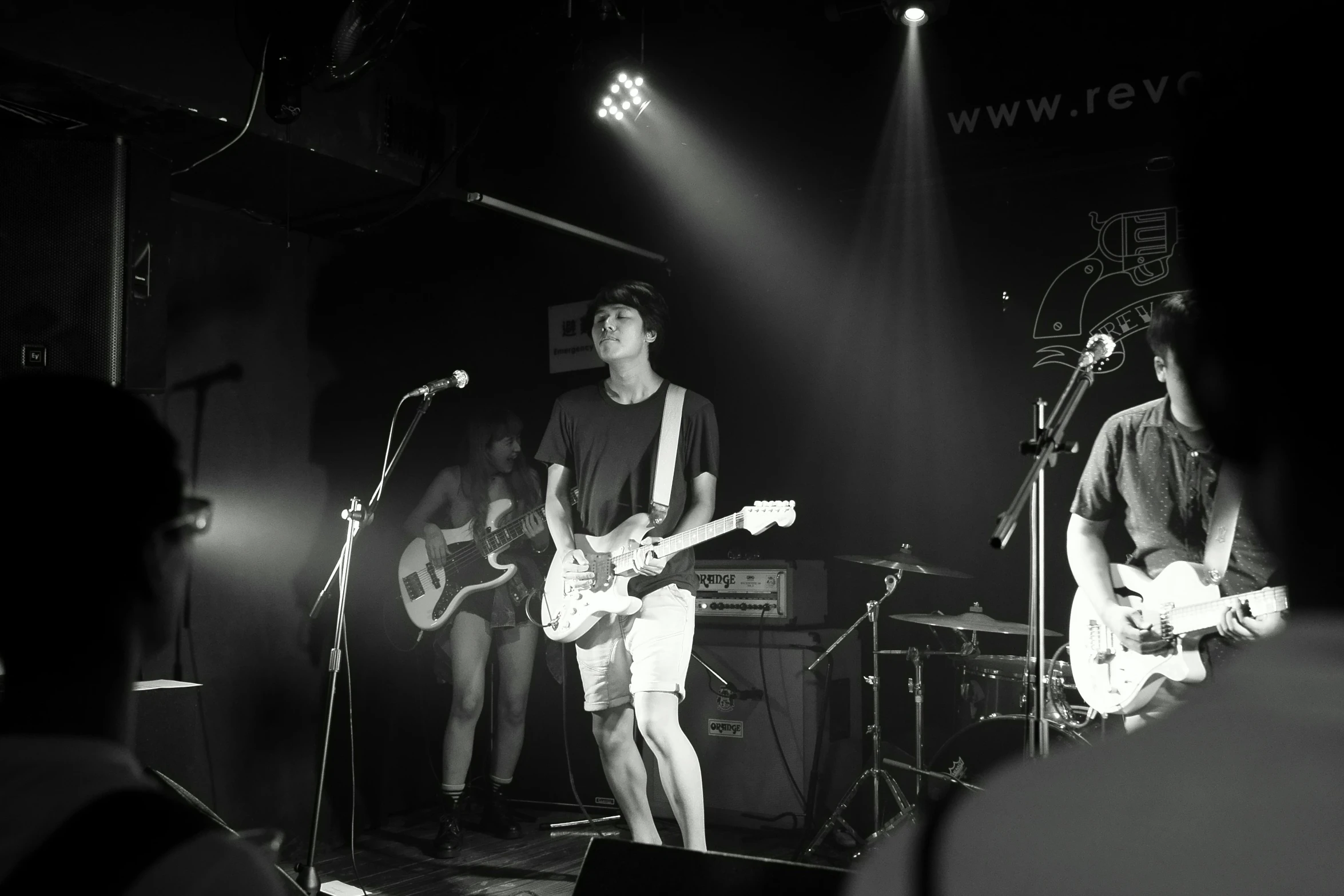 a group of young men standing on top of a stage