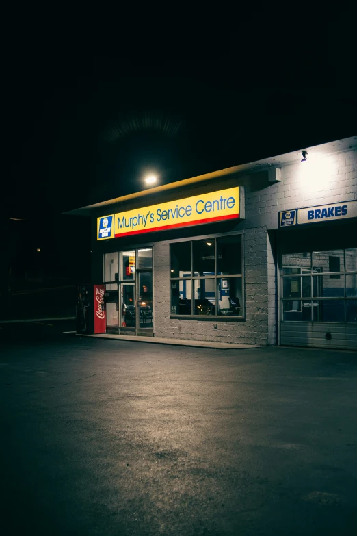 a black and white po of a drive thru building with the words hubatzr service center on the outside of it