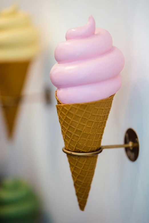 two ice cream cones with some sort of icing on them