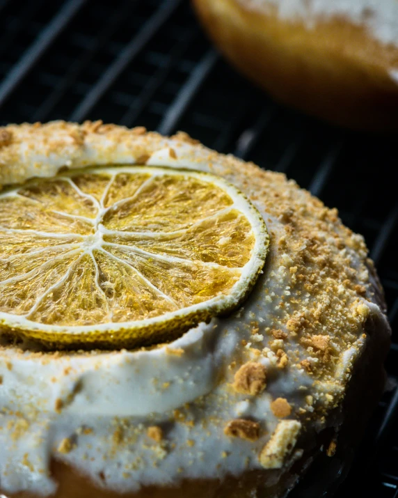 the lemon is sliced on the top of the cake