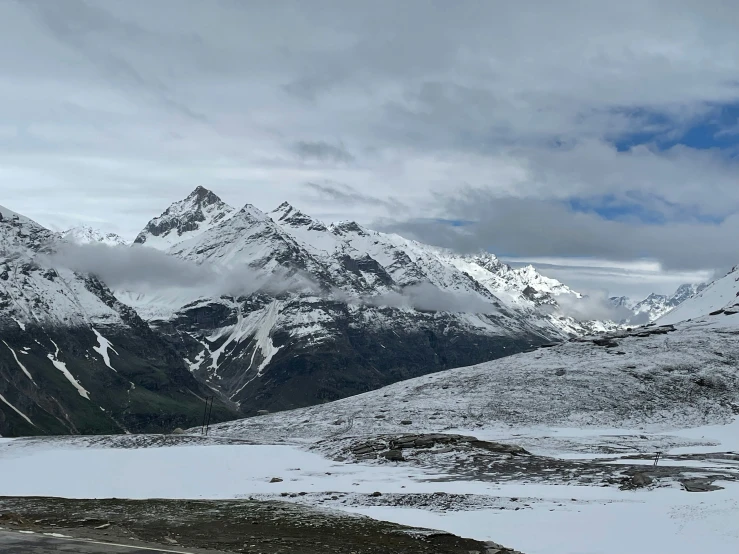 the landscape has many snow capped mountains