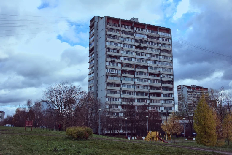 a very tall building sitting on the side of a road