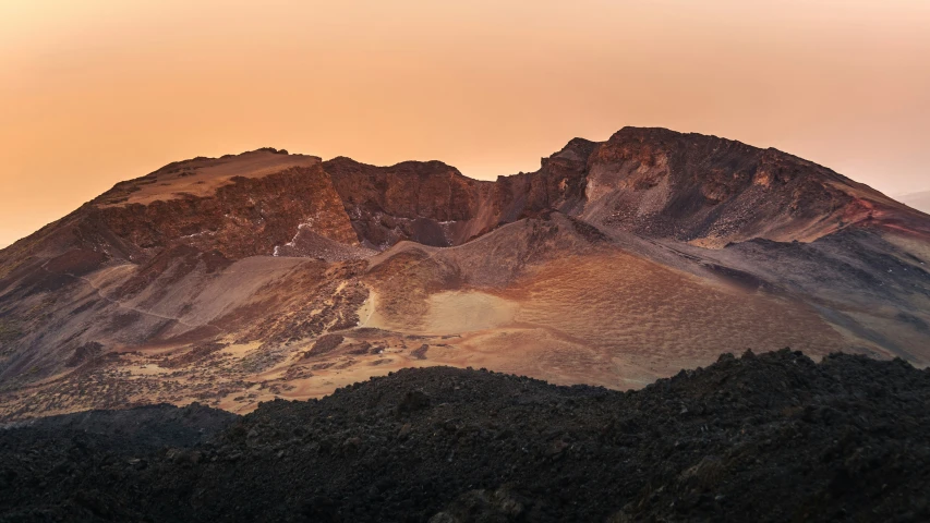 a large mountain peak rising above the valley