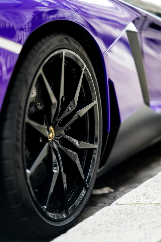 a close up po of a blue car wheels