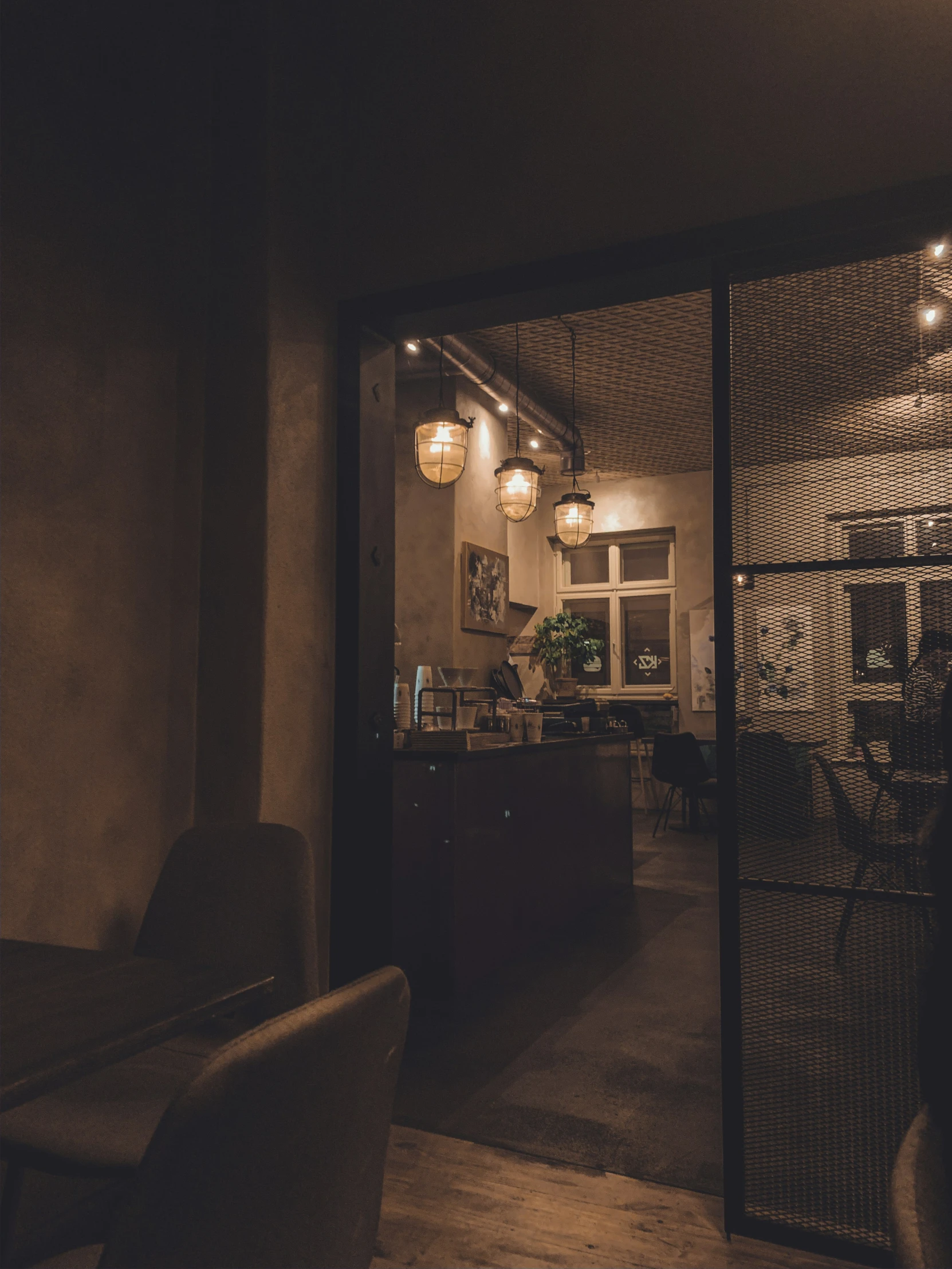 a view of a kitchen through the living room door