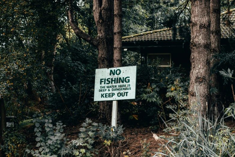 a sign reading no fishing and other rules to keep out
