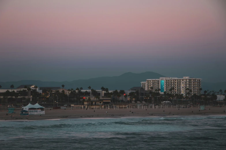 view of city skyline at dusk with waves