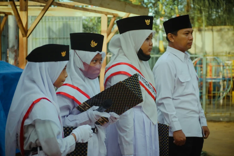 several people in traditional clothing standing next to each other