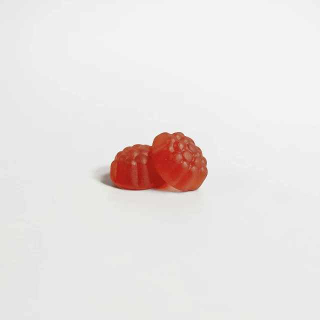 two pieces of candy on a white background