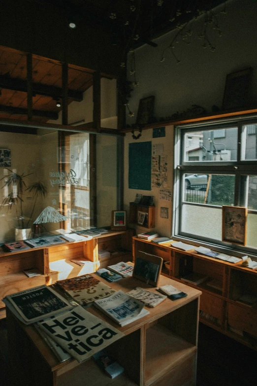 a desk with a lot of books sitting in it